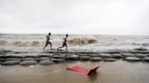 Cyclone floods coastal villages and cuts power in Bangladesh, where 800,000 had evacuated