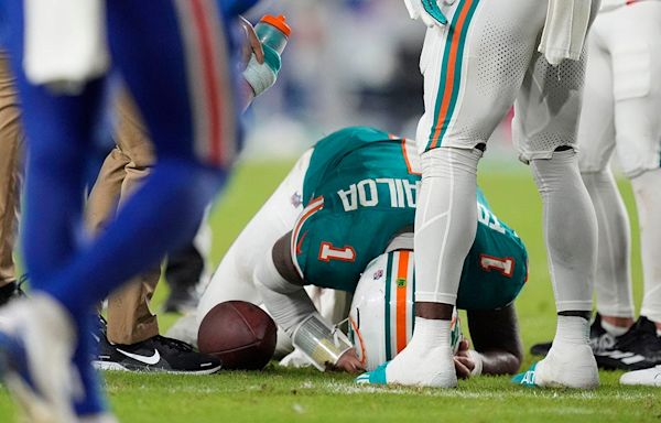 Dolphins' Tua Tagovailoa suffers concussion after big collision with Bills' Damar Hamlin