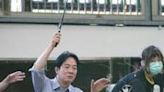Taiwan's President-elect Lai Ching-te (C) catches a shrimp next to King Mswati III of Eswatini (L) and Taiwan's Vice President-elect Hsiao Bi-khim (R)