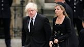 Carrie Johnson wears military-style dress as she accompanies Boris Johnson to Queen’s funeral