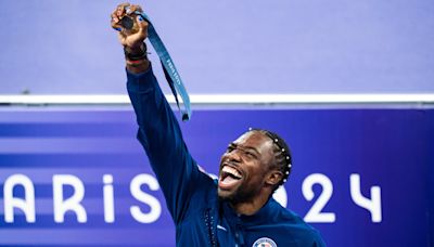 Noah Lyles has a gold medal around his neck and his eyes set on the stars