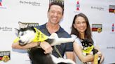 Hugh Jackman, Julianne Hough Cuddle Pups to Promote Dog Adoption as Bernadette Peters Shuts Down Protestors