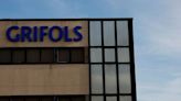 Grifols swings to profit, says debt reduction on track