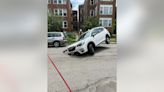 Photos show vehicle stuck in sinkhole in Chicago's Uptown neighborhood