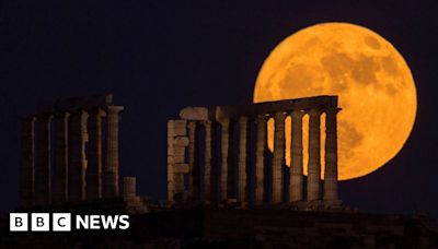 Strawberry Moon rises behind Greece's Temple of Poseidon