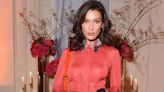 Bella Hadid steps onto the runway in nothing but her pants