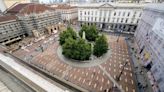 Mock coffins fill a square in Milan in a protest over workplace safety in Italy