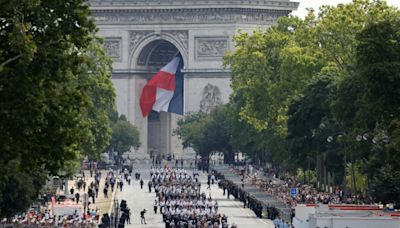 France celebrates national day as political crisis rumbles on