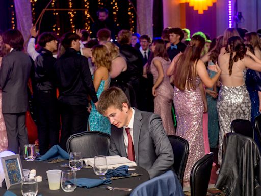 A high school senior was caught studying during prom. Here's the story behind the photo.