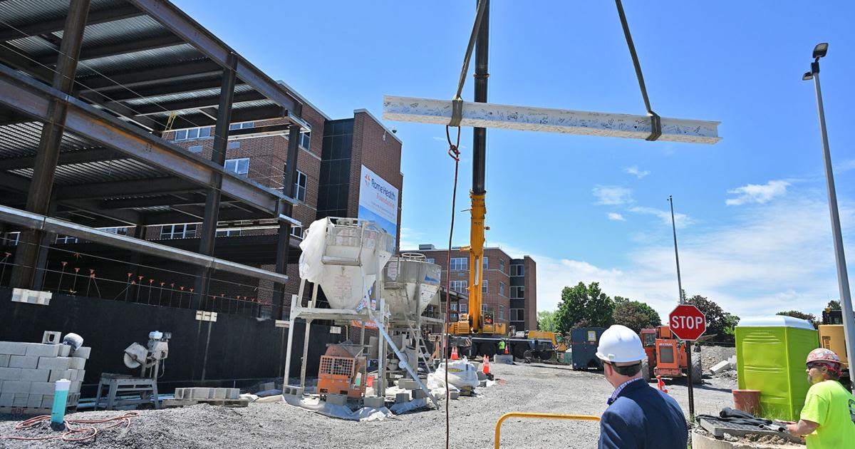 Ceremonial beam placed atop Rome Health construction