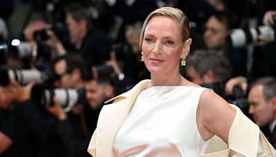 Uma Thurman sublime le trench-coat XXL sur le tapis rouge de Cannes