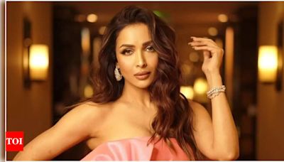Malaika Arora faces criticism for picking up garbage on the road; netizens say, 'she knows the cameras are on' | Hindi Movie News - Times of India