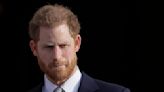 Prince Harry settles a tabloid phone hacking claim and says his mission to tame the media continues