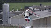 2 men are killed when their helicopter crashes into a hog house in central Ireland