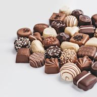 Chocolates are confectionery products made from cocoa beans, typically available in various forms. Chocolates vary in cocoa content, sweetness, and texture, appealing to a wide range of taste preferences.