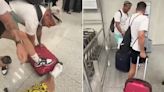 Traveller pulls off the wheels of his case to avoid baggage charges