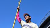 Julio Rodriguez of the Seattle Mariners holds up the team trident after the game against the Oakland Athletics at T-Mobile Park on Sunday, May 12, 2024, in Seattle.