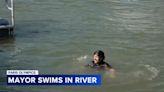 Paris mayor swims in Seine to show how clean the water is ahead of 2024 Olympics