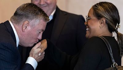 Eddie McGuire kisses Cathy Freeman at Olympic hero's memorial