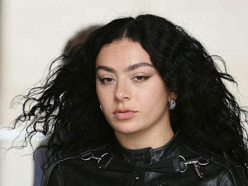 Charli XCX Revs Up Her Moto Jacket With Some Trippy Black Wide-Legged Jeans