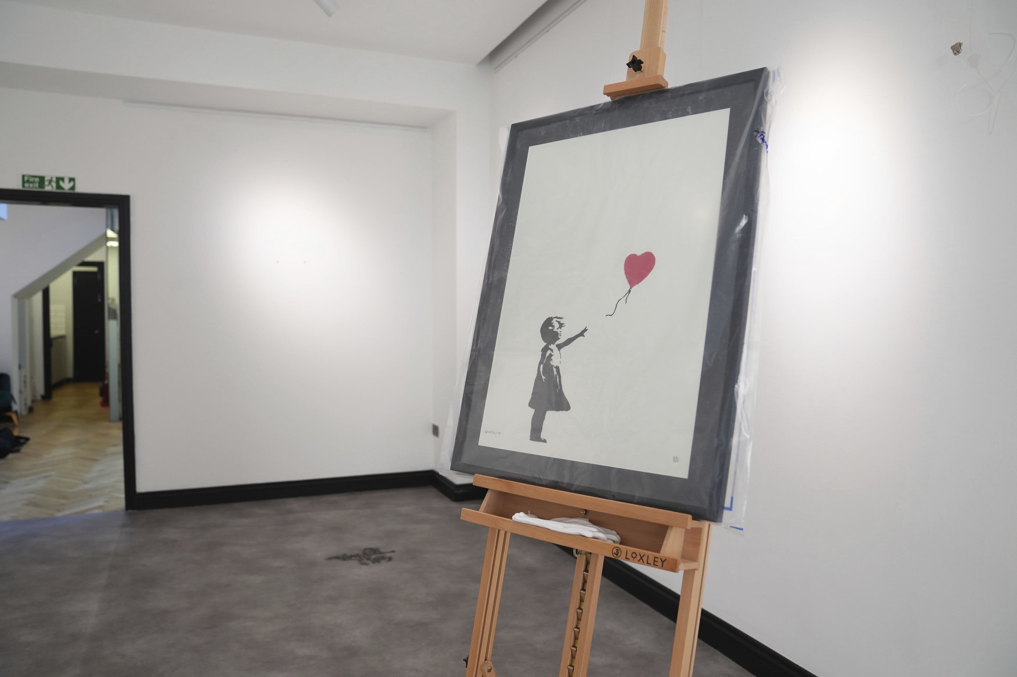 2 men are charged with stealing a famous Banksy artwork from a London gallery