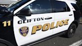 Man charged after walking around Clifton neighborhood in camo carrying rifle, say police