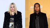 Avril Lavigne and Tyga seemingly confirm relationship with kiss during Paris Fashion Week