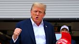 Donald Trump waves to crowd and visits McLaren garage at F1 Miami Grand Prix