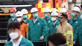 South Korean rescuers search burned factory after a blaze killed 22, mostly Chinese migrants