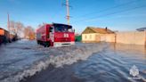 Record flood waters rise in Russia's Urals, forcing thousands to evacuate