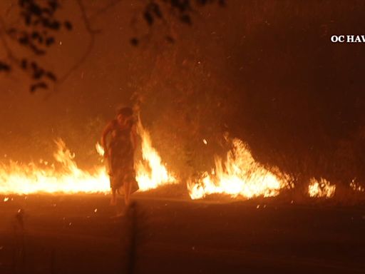 Video shows firefighters rescue woman from blazing Airport fire