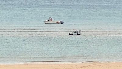 RNLI vehicle submerged by the sea at South West beach