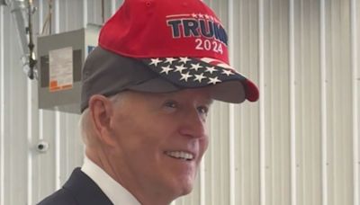 'No eating dogs and cats,' Biden jokes as he wears Trump 2024 hat