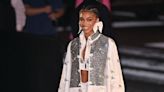 Lori Harvey Ditches the Pants in a High-Fashion Sweater Set and Sheer Tights