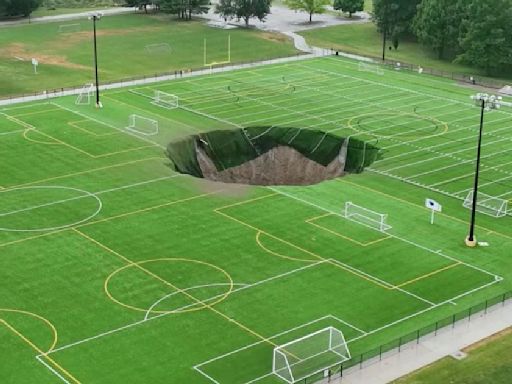 Massive sinkhole swallows Illinois soccer field after mine collapses