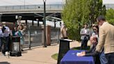 Colorado Governor Jared Polis signs a priority land-use bill passed this session at the Evans Light Rail Station in Denver on May 13, 2024.