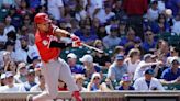 Santiago Espinal hits 2-run homer, Reds hold on to beat Cubs 5-4