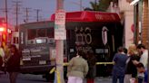 14 injured when bus and car collide and smash into a Long Beach restaurant