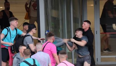 Shocking moment British holidaymakers brawl outside Ibiza airport