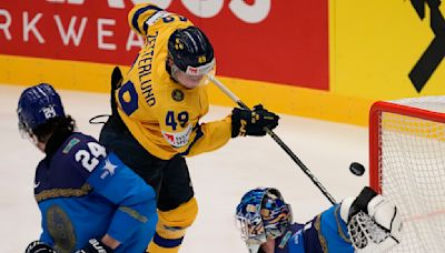 Sweden beats Kazakhstan to keep perfect record at hockey worlds, Austria upsets Finland