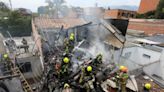 Small plane carrying eight people crashes into residential area of Colombia killing all onboard