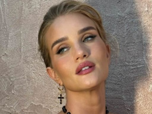 Rosie Huntington-Whiteley stuns in a semi-sheer lace jumpsuit in Italy