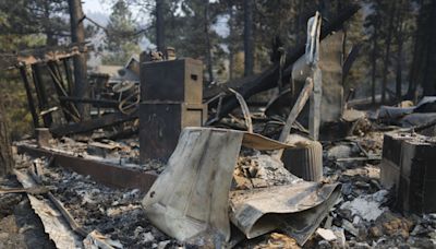 A scenic California mountain town walloped by a blizzard is now threatened by wildfire