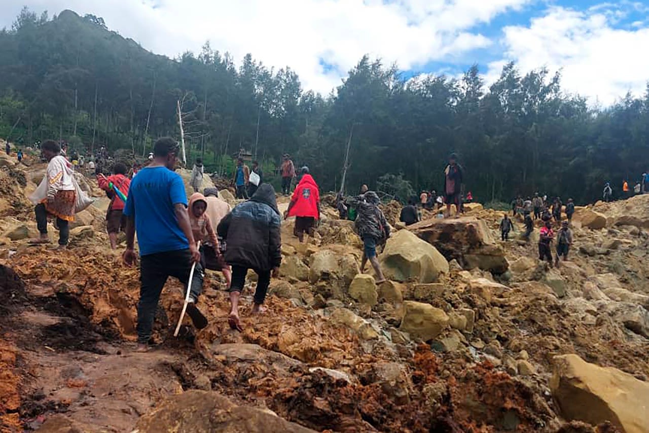 Emergency crews in Papua New Guinea move survivors of massive landslide to safer ground