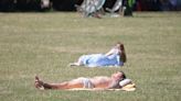 Brits take a dip in the sea and sunbathe as heatwave grips the UK