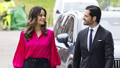 Princess Sofia of Sweden wows in bold pink blouse as she joins husband Prince Carl Philip at a disability conference in Stockholm