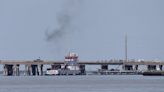 Barge hits Texas bridge, spilling oil and trapping workers on island