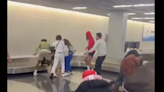 Two arrested over Chicago airport fight as video goes viral