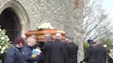 Paul O’Grady’s coffin carried into church as Battersea dogs form ‘guard of honour’