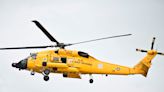 Crazy videos show a Coast Guard helicopter nearly crashing into the ocean after abandoning a rescue attempt on a Carnival cruise ship during a storm